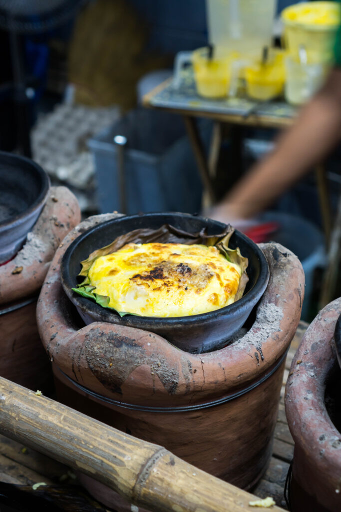 Traditional way of cooking Bibingka