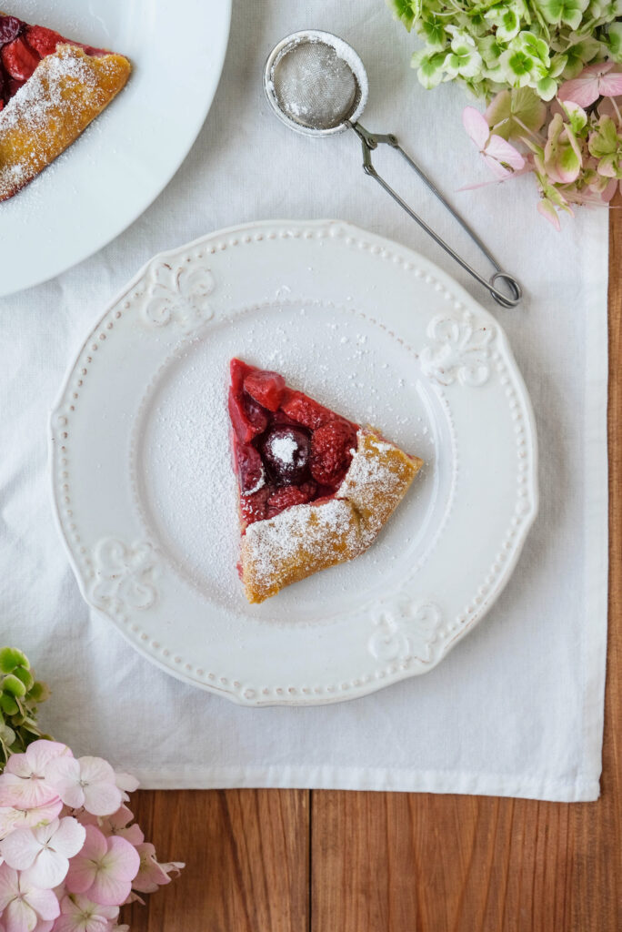 A slice of delicious Vegan Strawberry and Cherry Galette